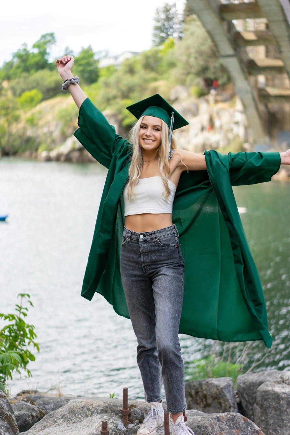 woman in green academic dress and white brassiere