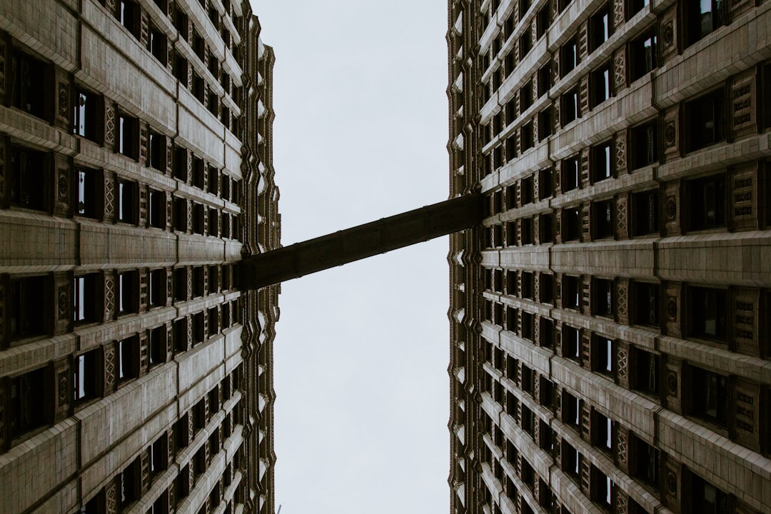 white and black concrete building under blue sky during daytime