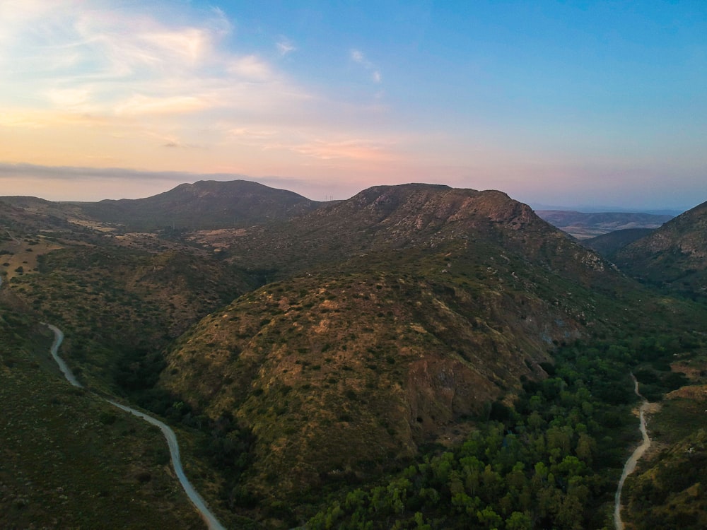 green and brown mountain under blue sky during daytime