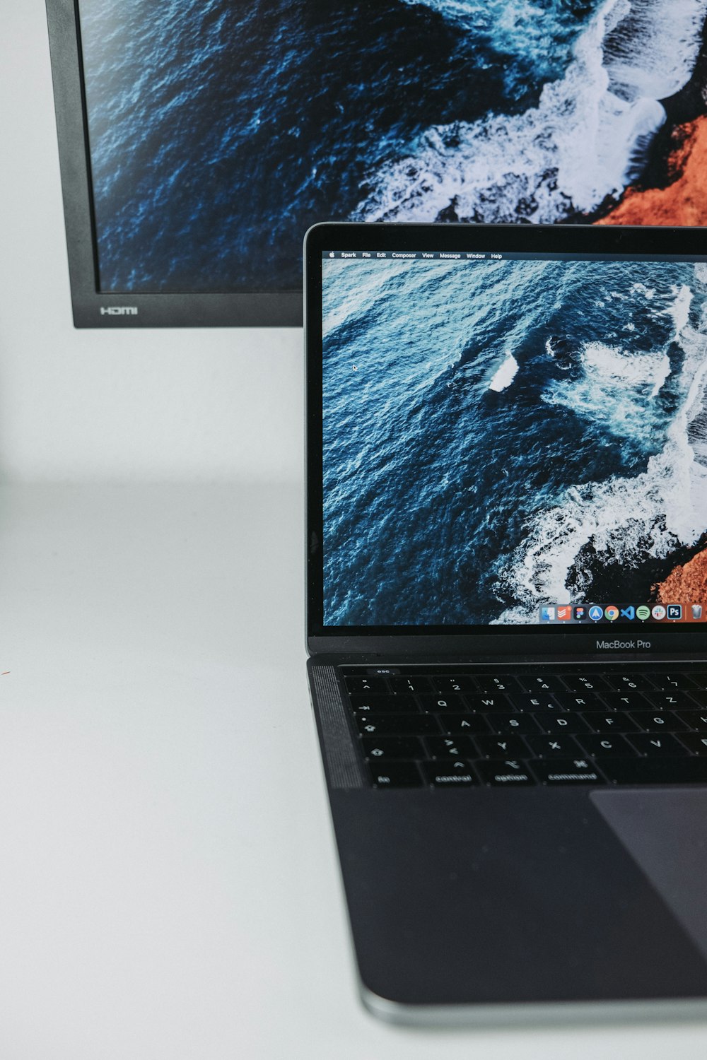 macbook pro on white table