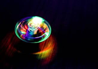 Futuristic scientist Captain Giroxx analyzing spinning Beyblades with neon blue and gold holograms.