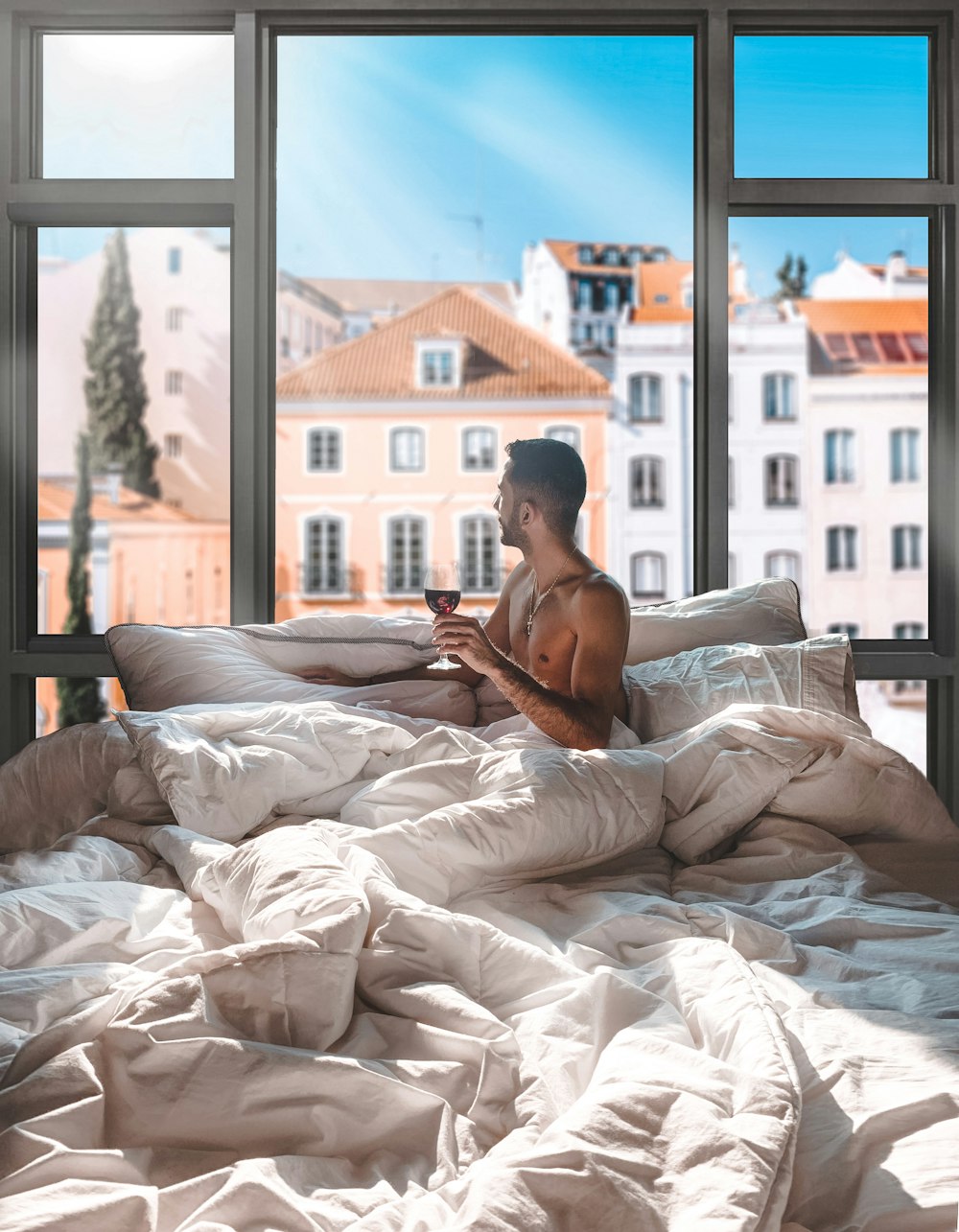 man in white shorts lying on bed