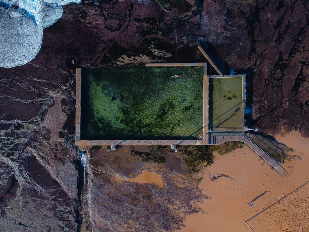 green grass on brown rock formation