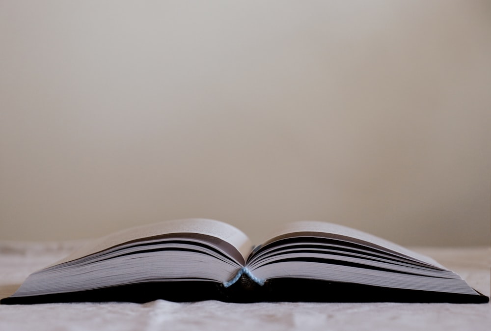 white book page on brown wooden table