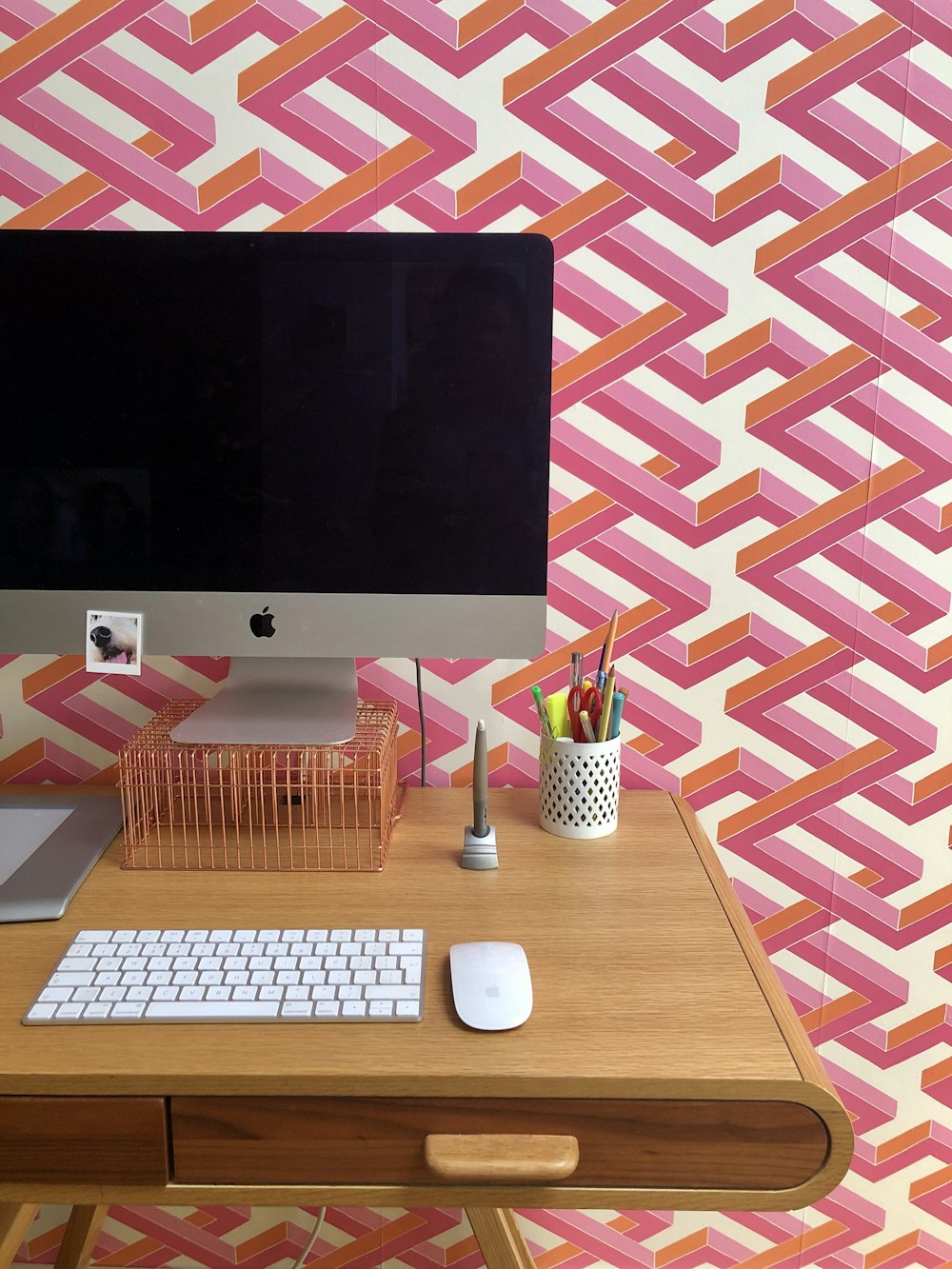 silver imac on brown wooden table