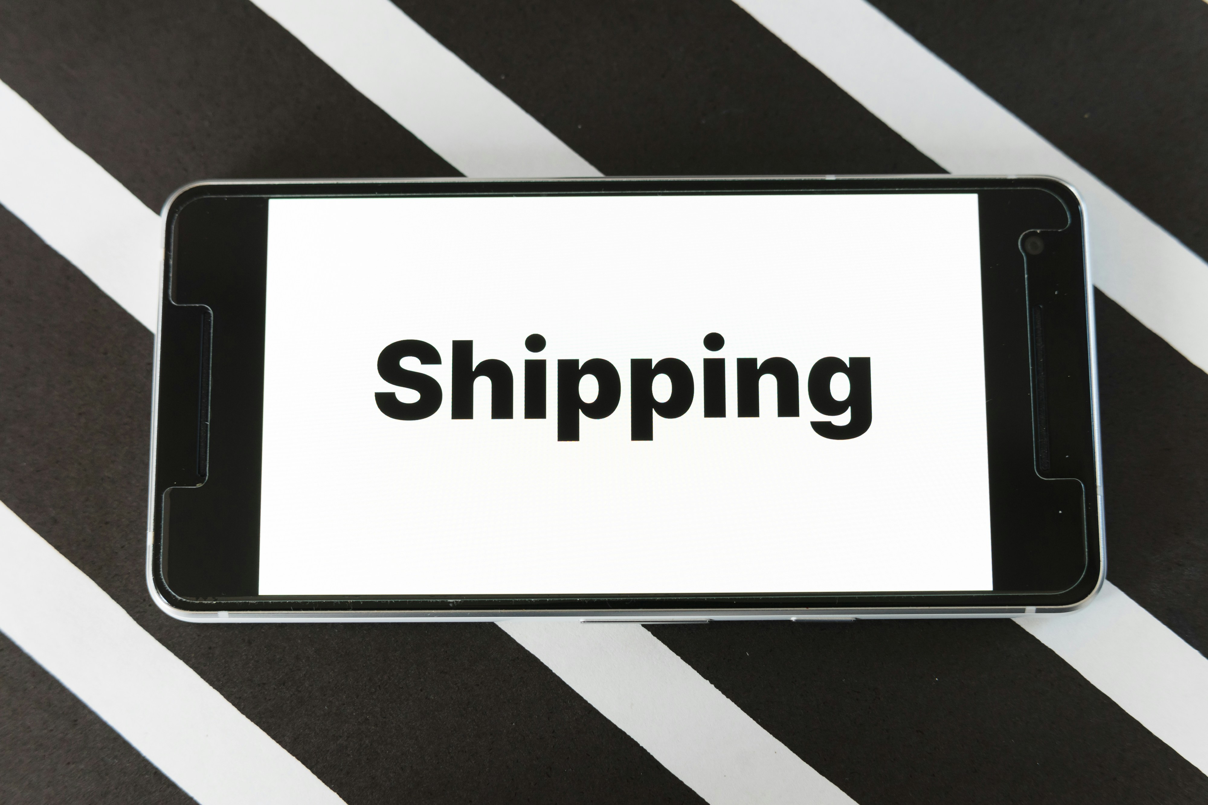 Smartphone displaying push notifications for shipment status updates and delivery alerts