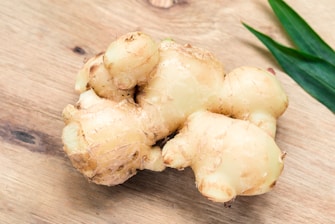 white ginger on brown wooden table
