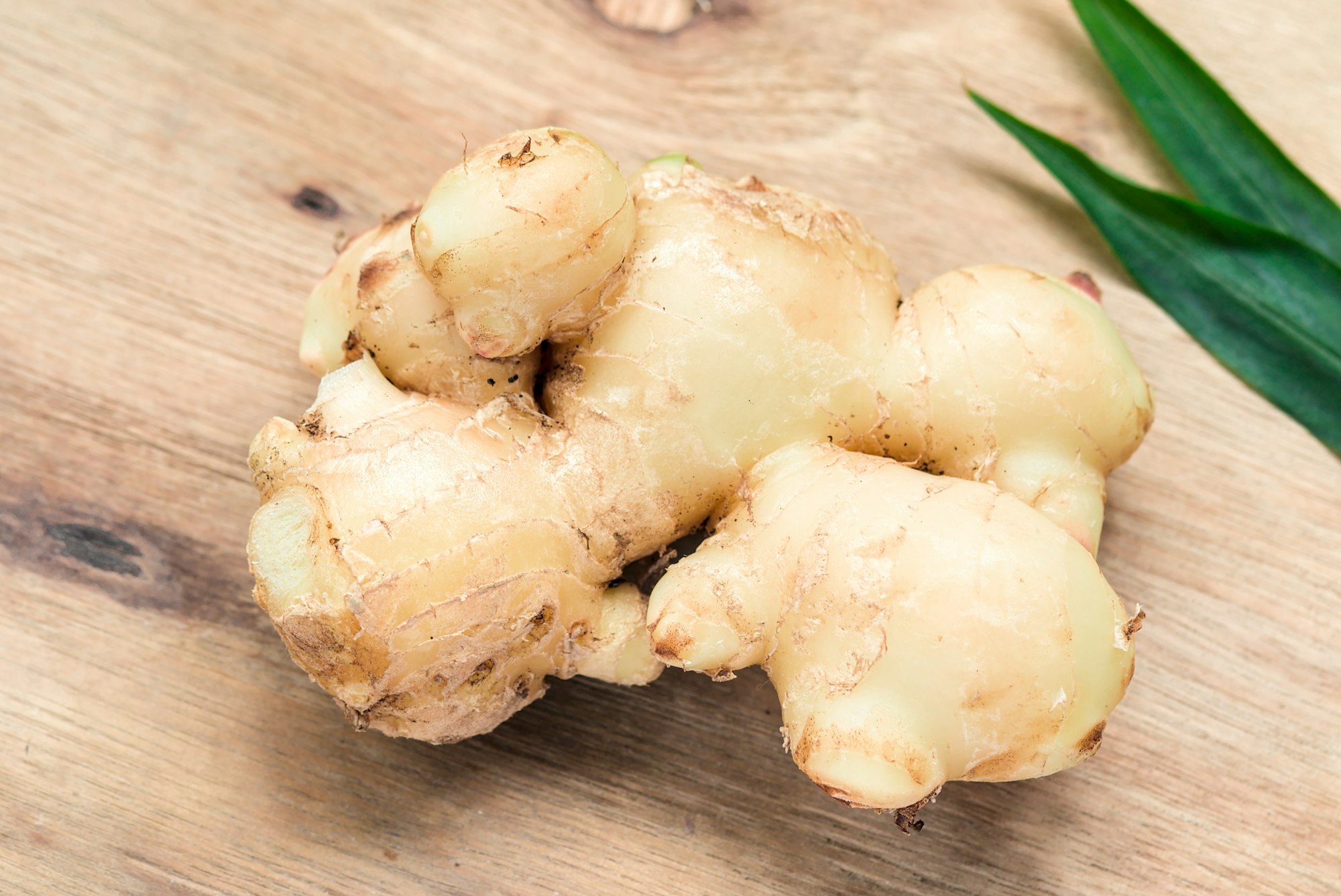 fresh ginger on brown wooden table
