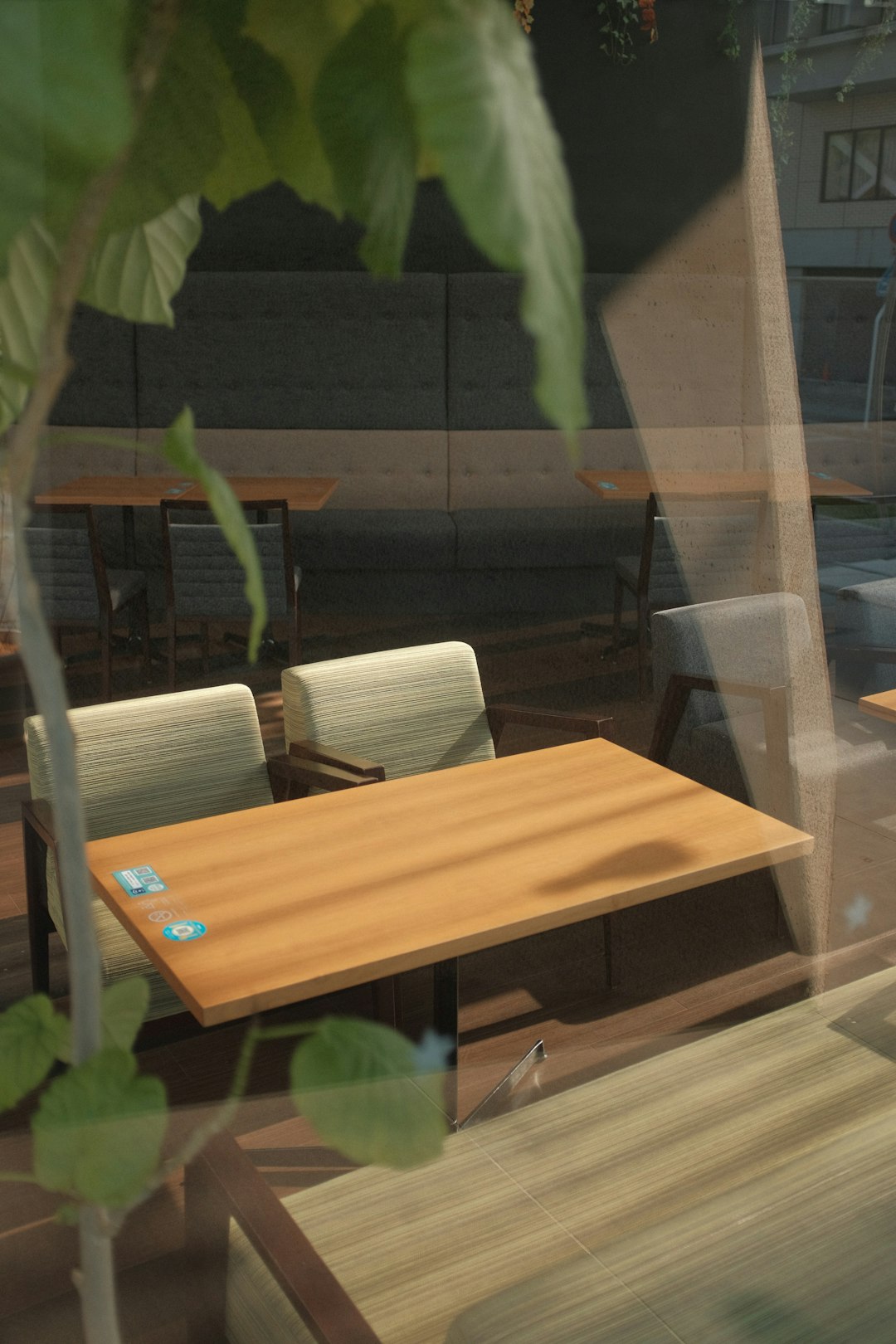 brown wooden table near green plant