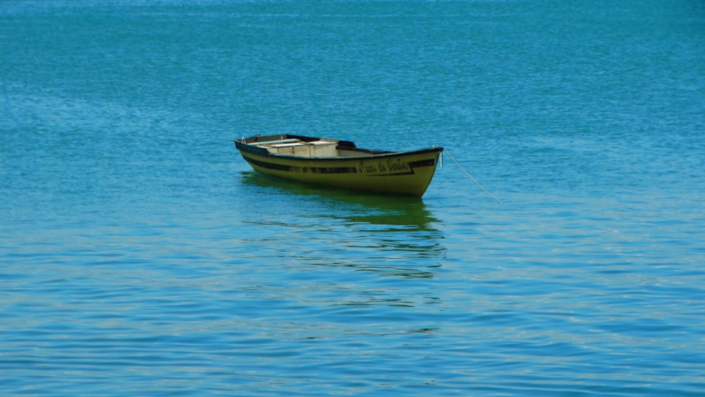 brown boat on blue sea during daytime