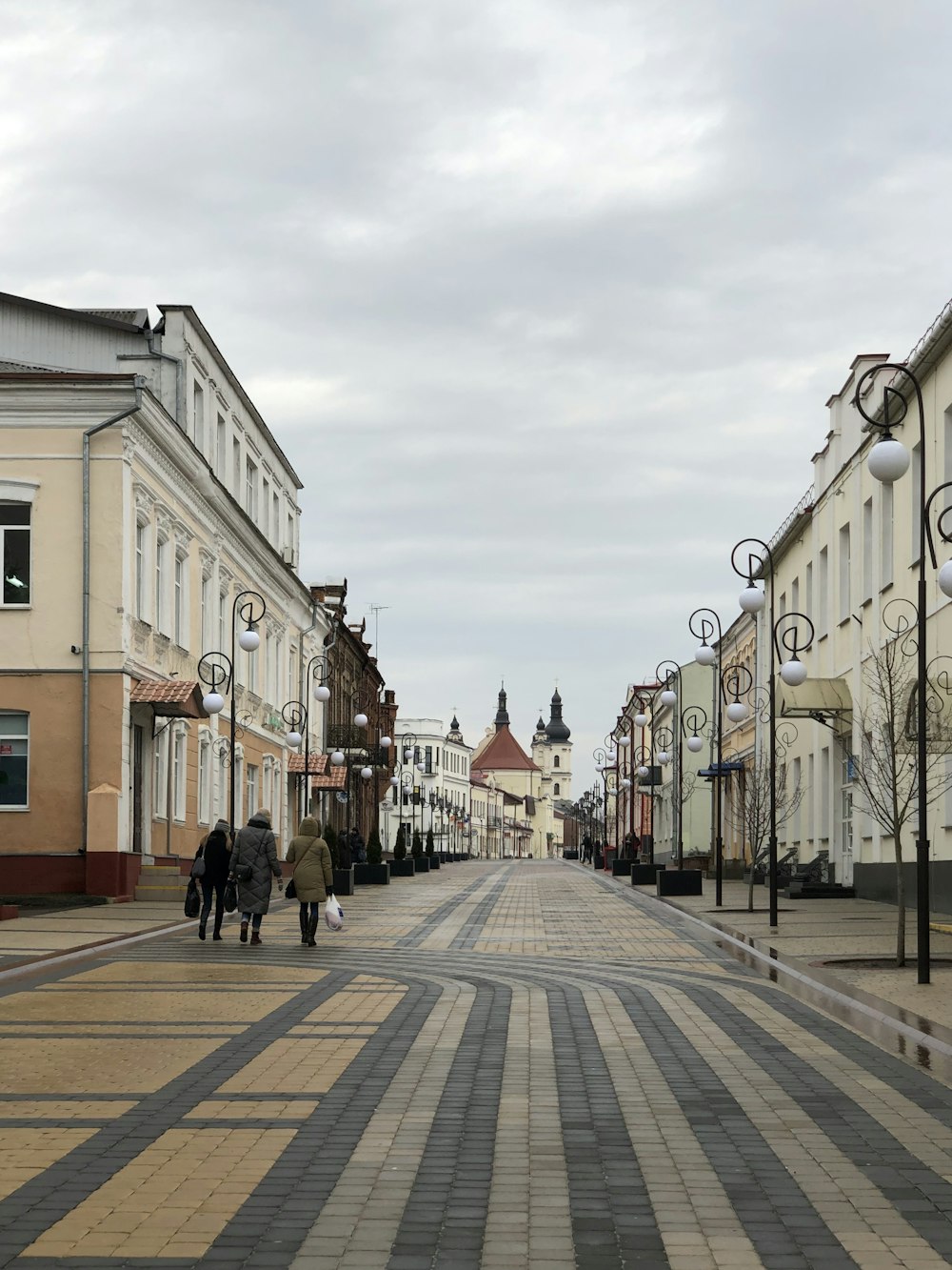 people walking on street near buildings during daytime