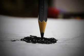 black pencil on white surface