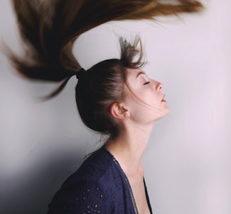 woman in black shirt with brown hair