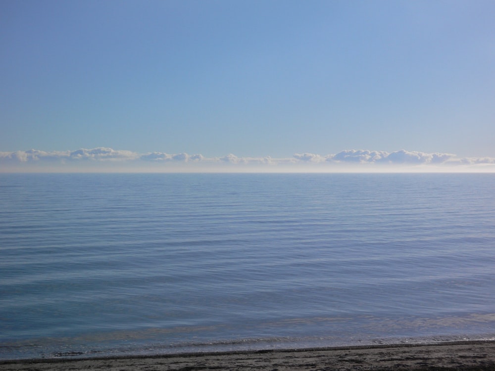 blue sea under blue sky during daytime