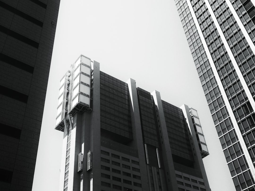 grayscale photo of high rise building