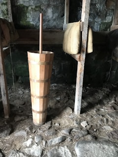 Traditional churning scene showing fresh ghee being prepared in a rustic setting with natural lighting