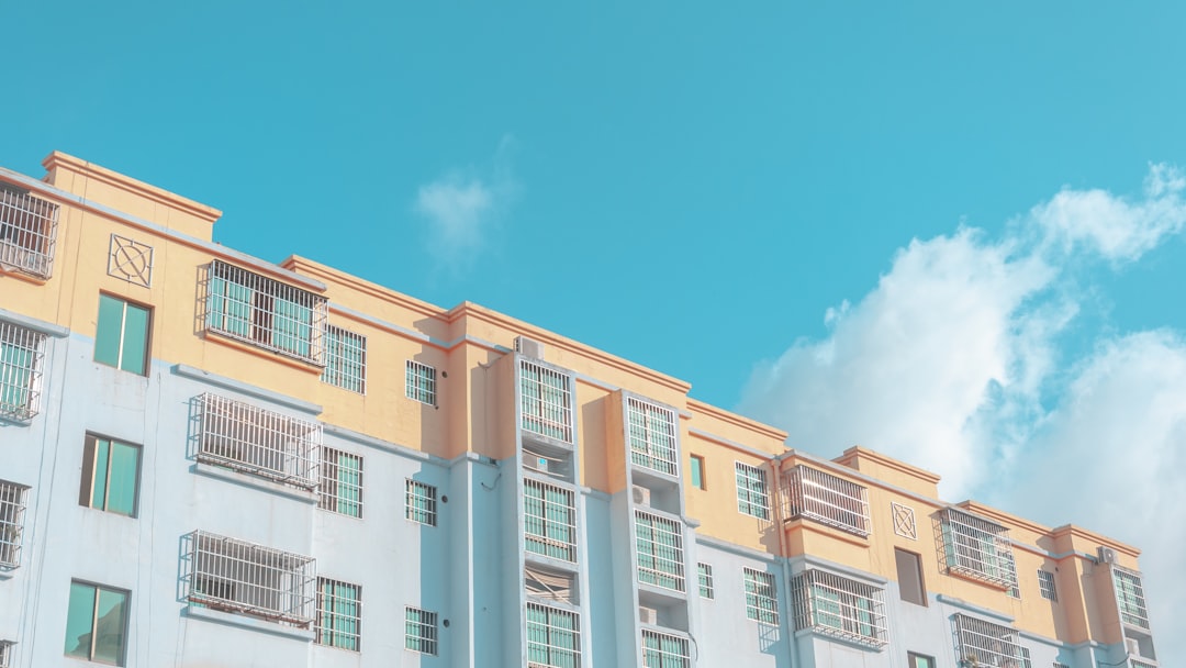 white and brown concrete building under blue sky during daytime,