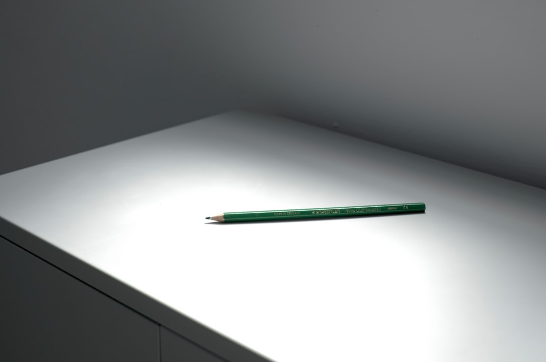 green pencil on white table