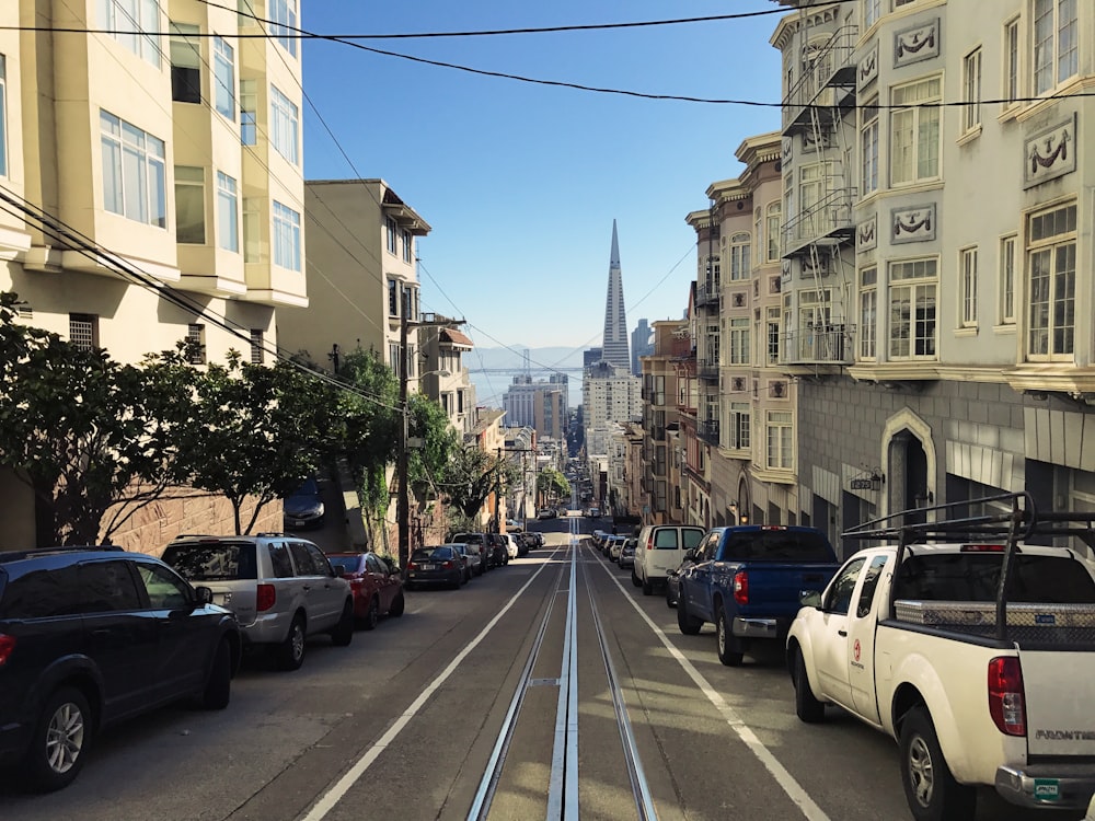 cars parked on side of the road during daytime