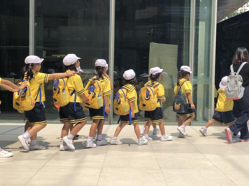 group of people wearing yellow and blue jersey shirts