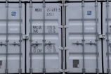 Close-up of shipping labels and documents used in international cargo.