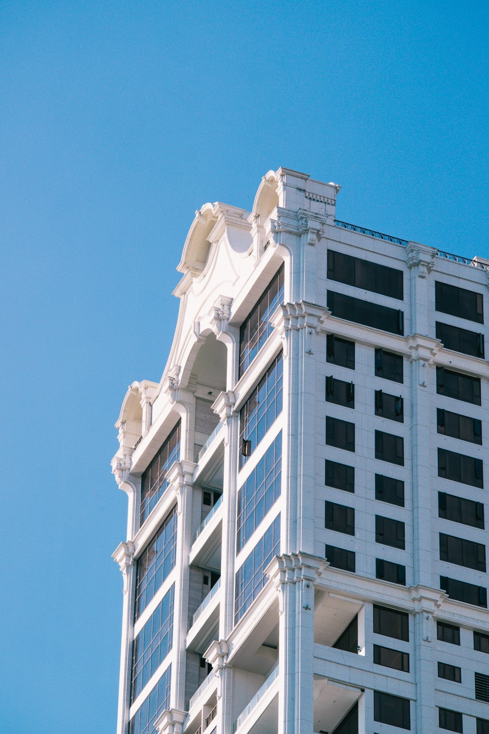 white concrete building under blue sky during daytime