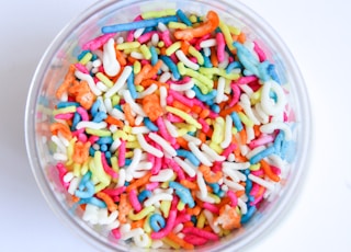 assorted color candies in clear glass bowl