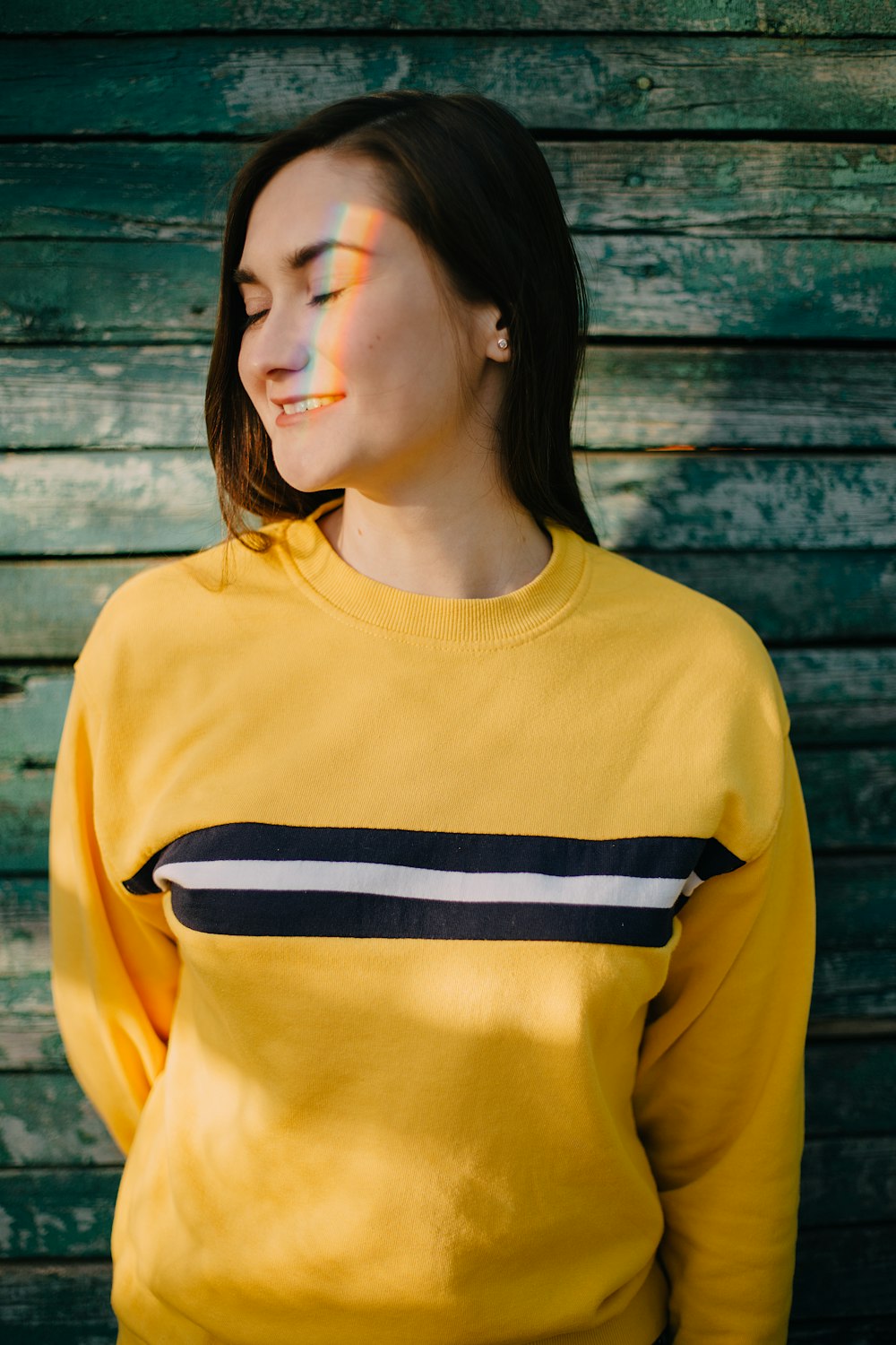 woman in yellow and black crew neck shirt