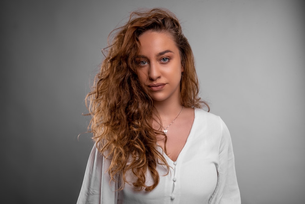 woman in white long sleeve shirt