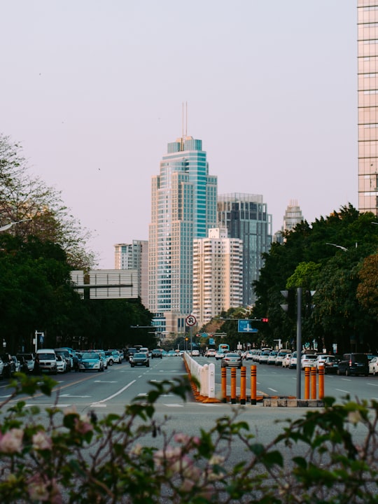 cars on road near high rise buildings during daytime in Shenzhen China