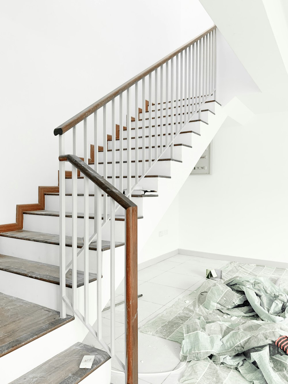 white staircase with white wooden railings