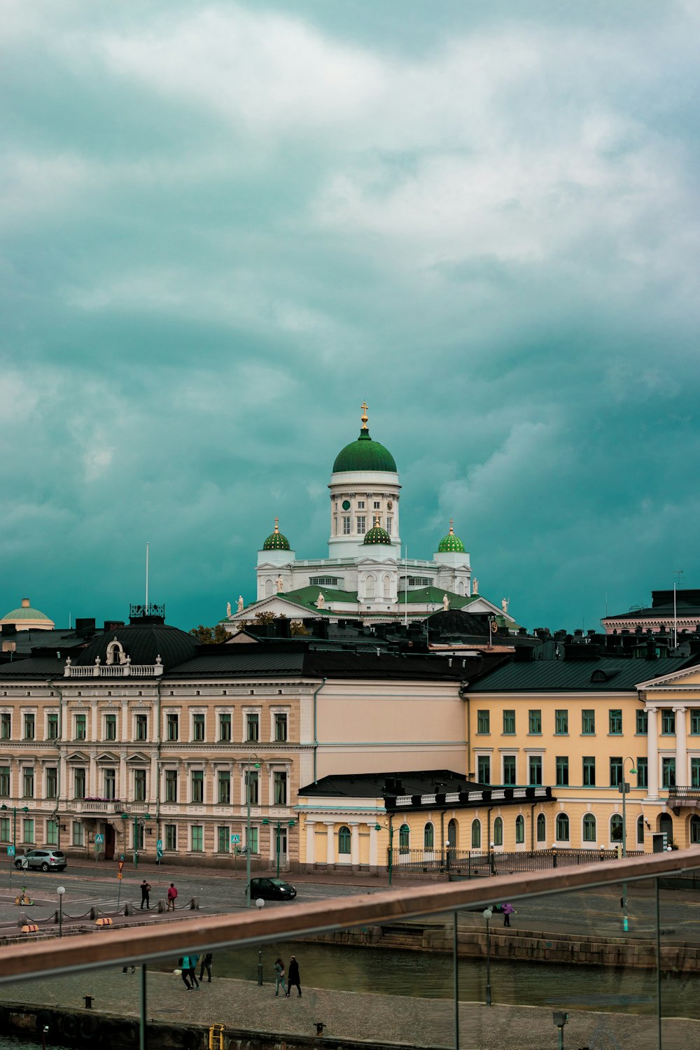 white concrete building under cloudy sky during daytime