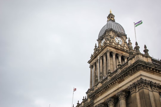 white concrete building under white sky during daytime in Leeds Town Hall United Kingdom
