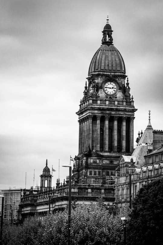 grayscale photo of concrete building in Leeds Town Hall United Kingdom