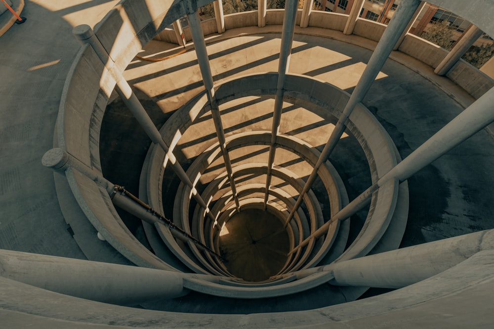 brown spiral staircase with brown wooden railings