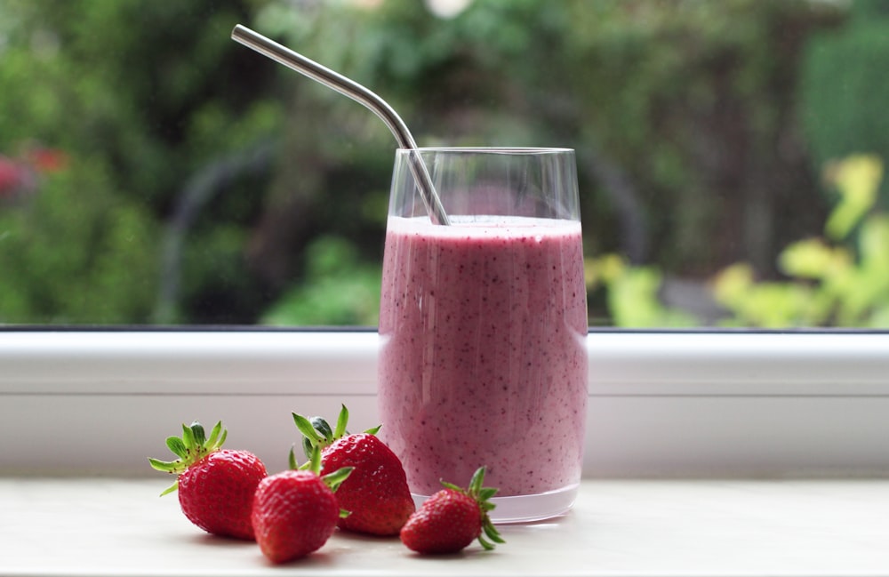 strawberry shake in clear drinking glass