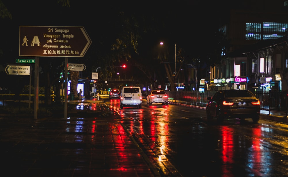 white car on road during night time