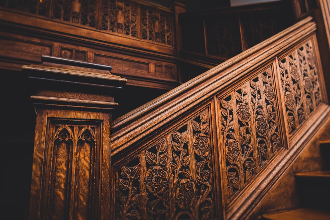 brown wooden staircase with brown wooden railings