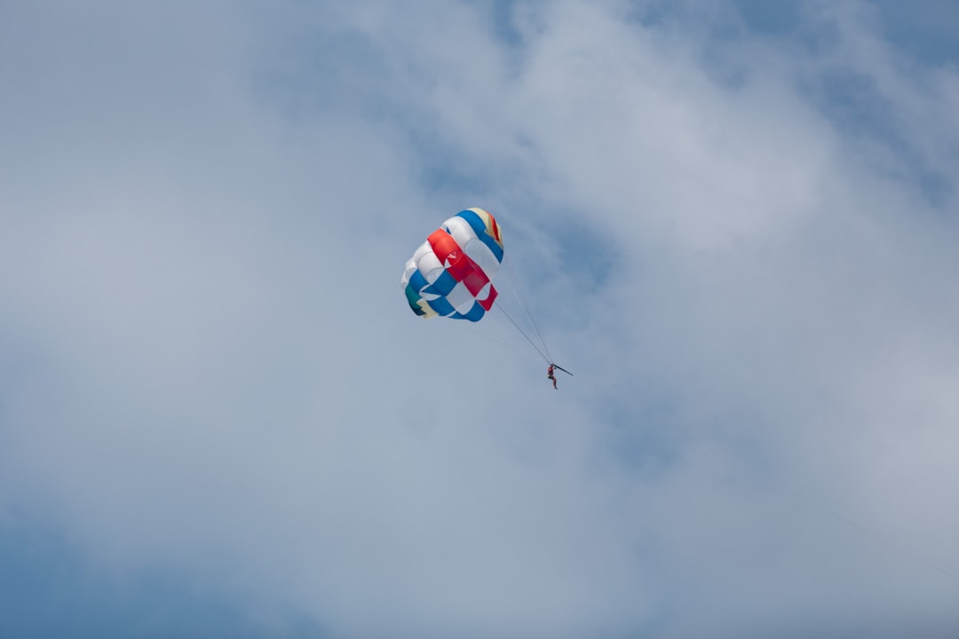 red yellow and blue parachute in the sky