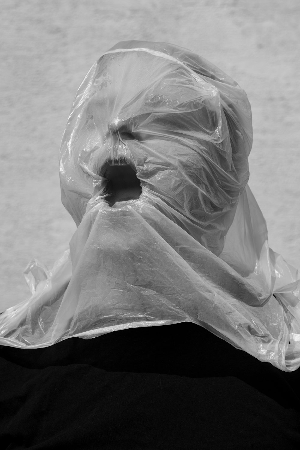 white plastic bag on gray concrete floor