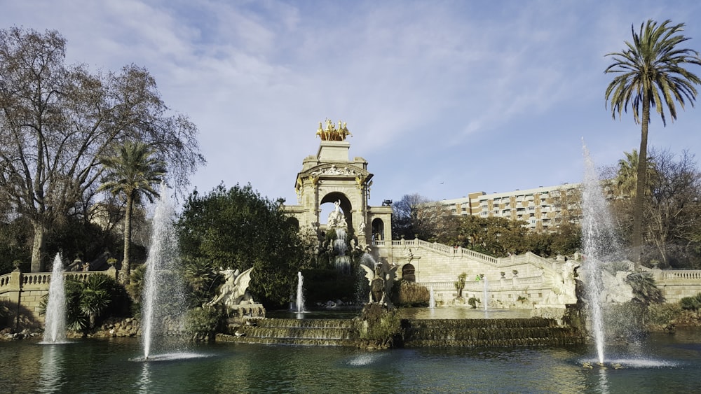 fountain in the middle of the city during daytime