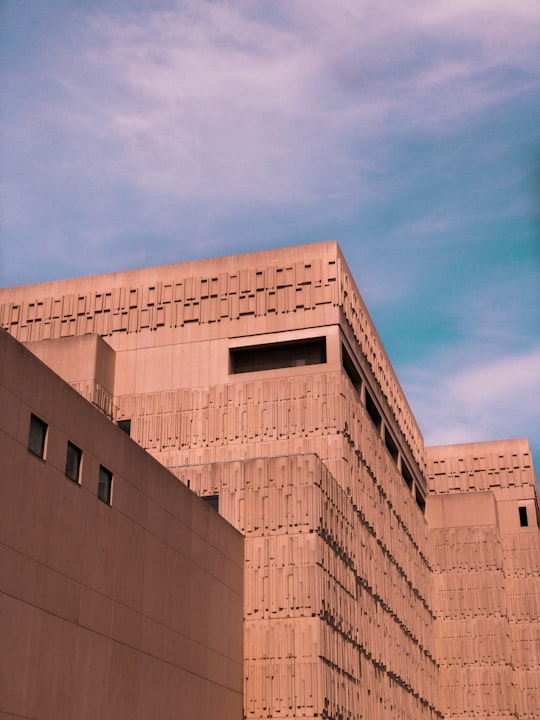 brown concrete building under blue sky during daytime in University of Toronto - St. George Campus Canada