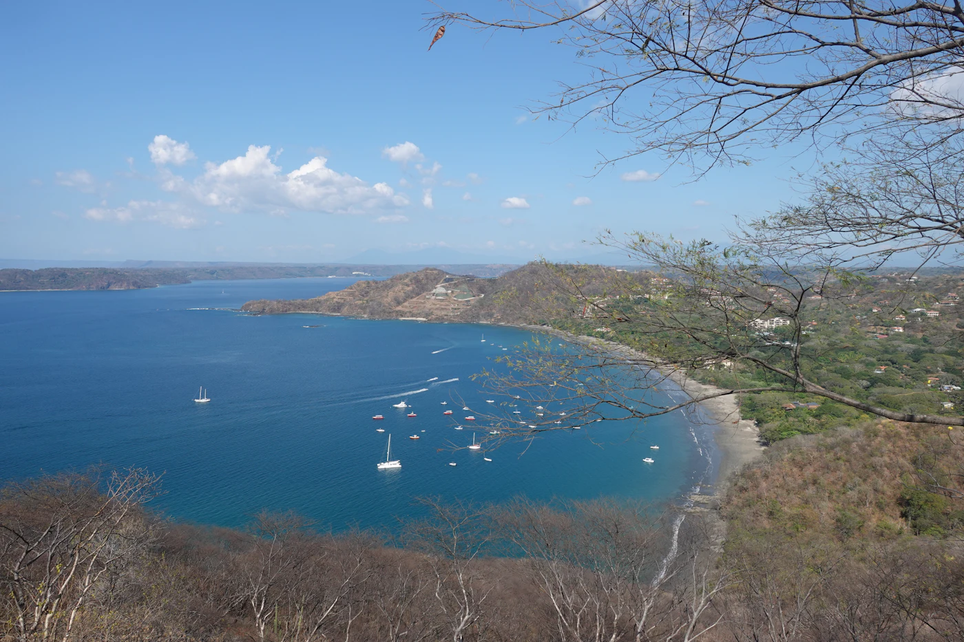 Boat on blue water along the Guanacaste coast in dry season