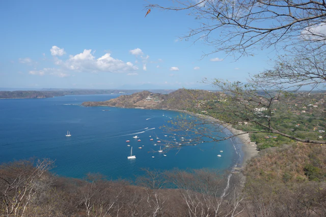 Boat on blue water along the Guanacaste coast in dry season