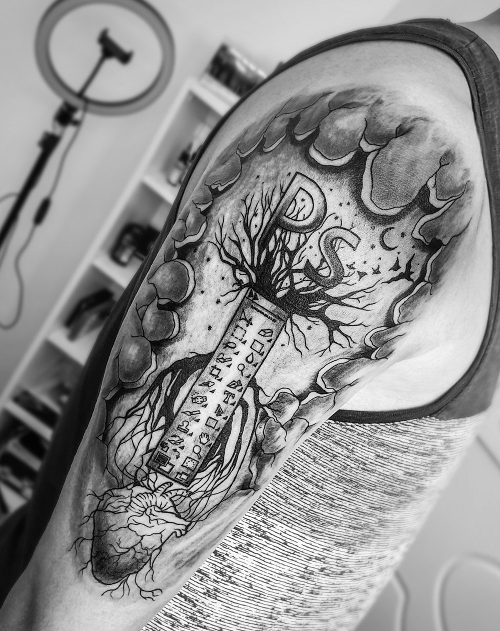 grayscale photo of skull tattoo