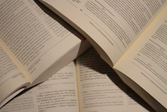 Close-up of students reading books together in the well-lit school library.