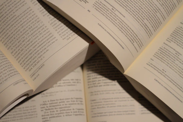 Close-up of students reading books together in the well-lit school library.
