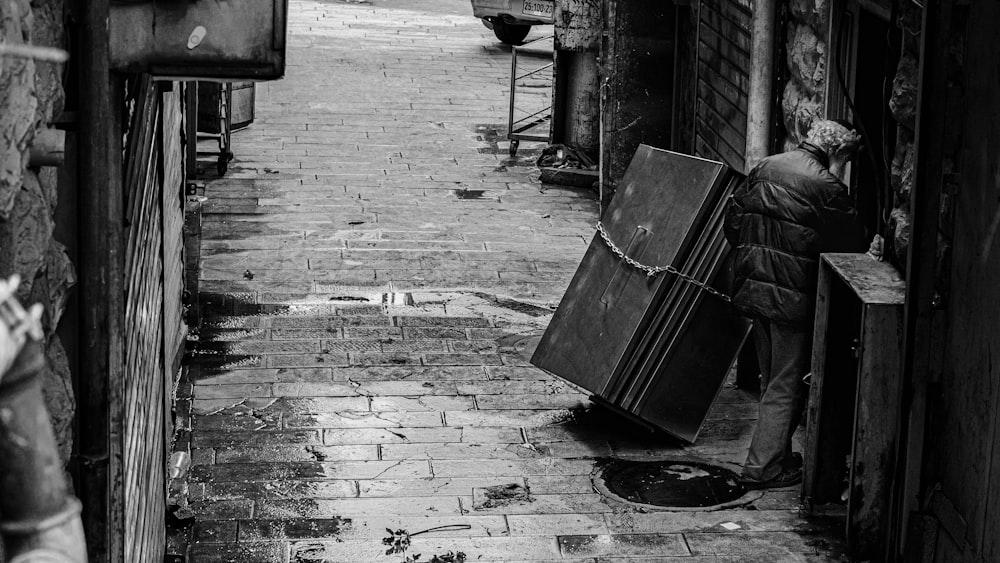 grayscale photo of brick wall