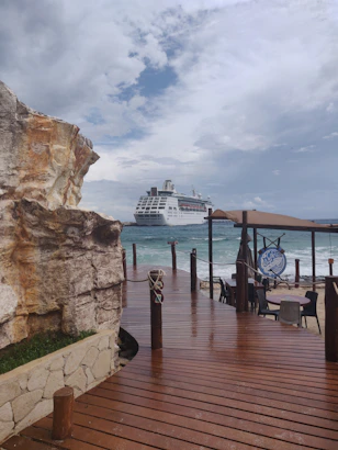 white and blue ship on sea dock during daytime