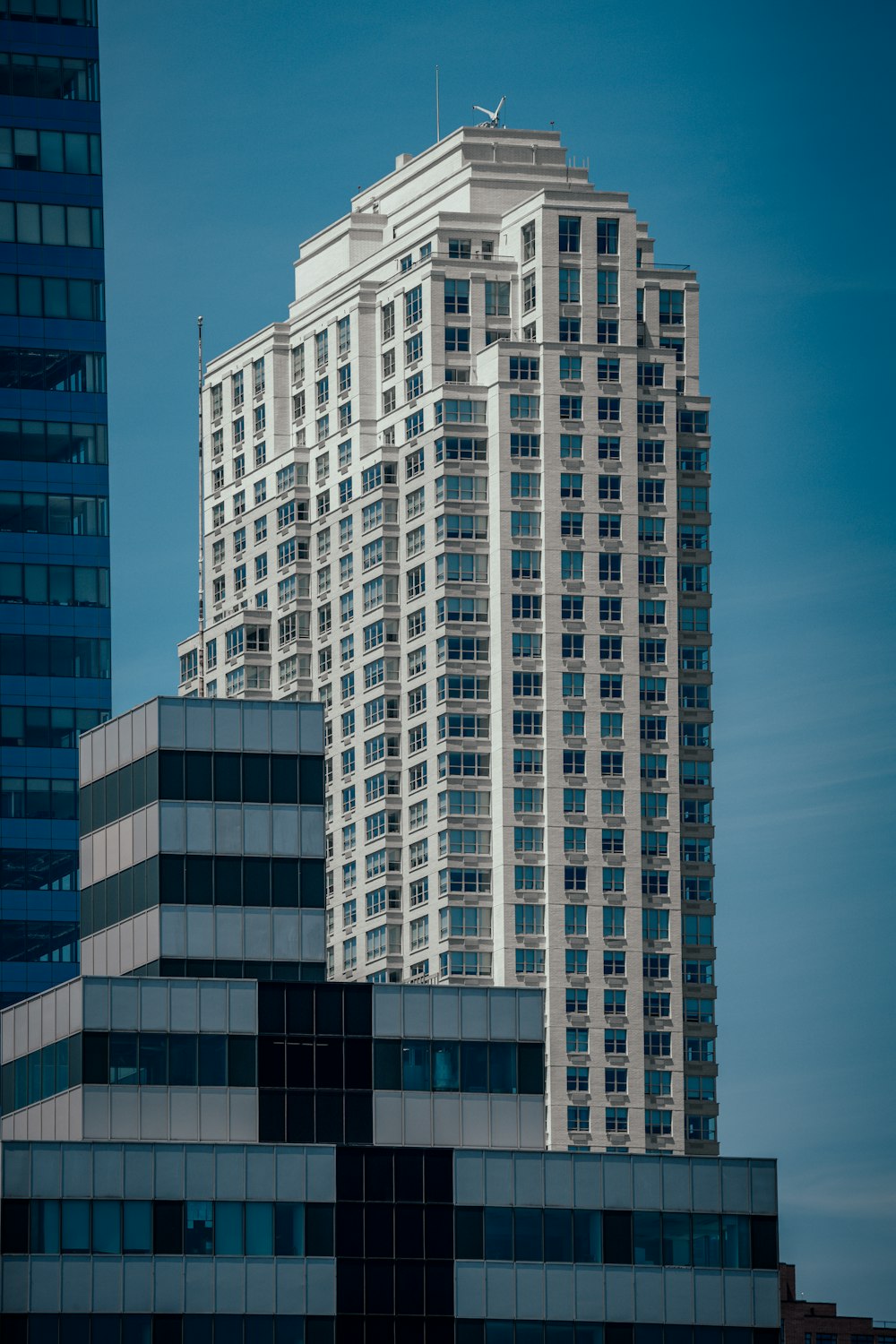 white concrete building under blue sky during daytime